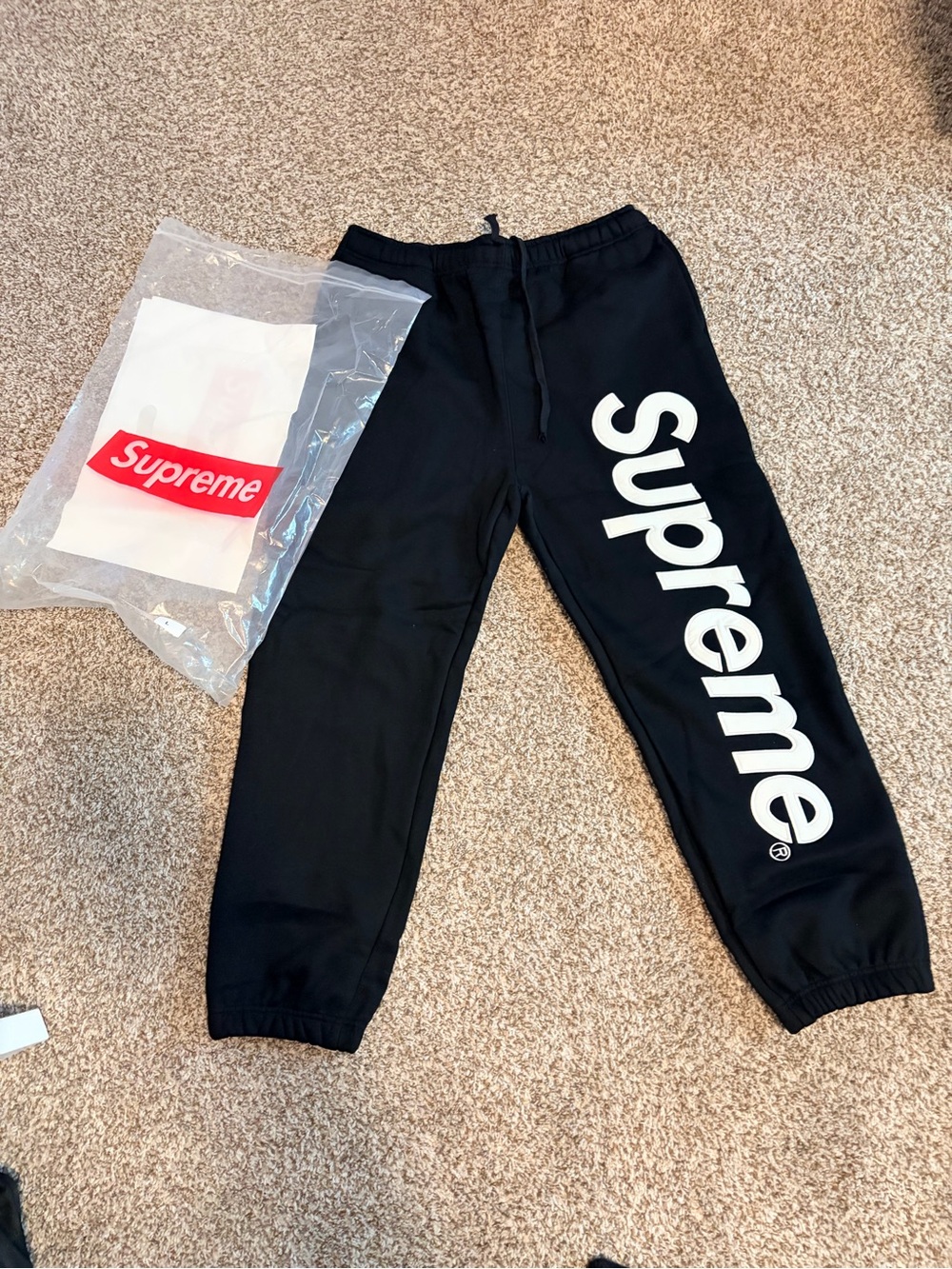 Supreme Black Sweatpants with White Vertical Logo Down Leg size large
